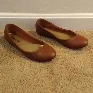 Brown leather flats